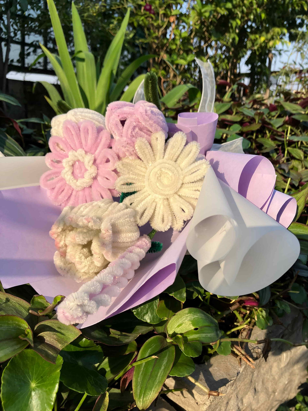Decorative flower-shaped object with a bow on a natural background