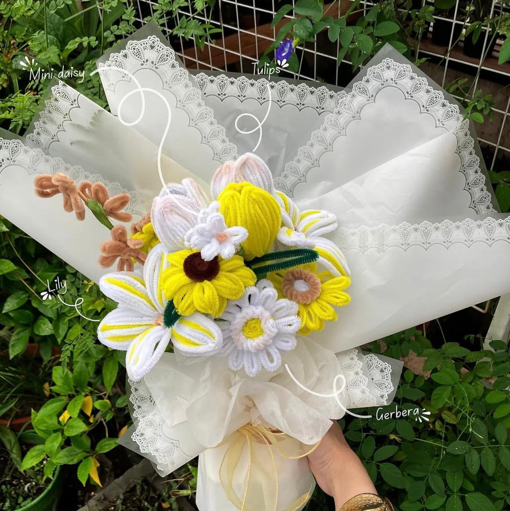 Bouquet of knitted flowers with labels on a white background