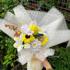 Bouquet of knitted flowers with labels on a white background