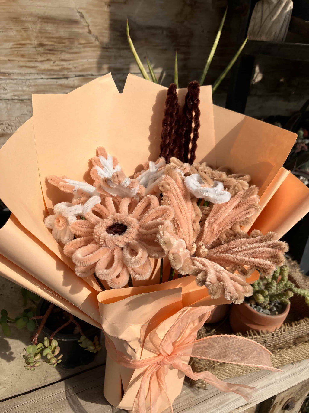 Bouquet of decorative flowers with a rustic background