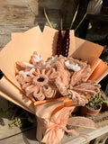 Bouquet of decorative flowers with a rustic background