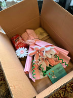 Bouquet of cookies in a box with a card on a textured surface