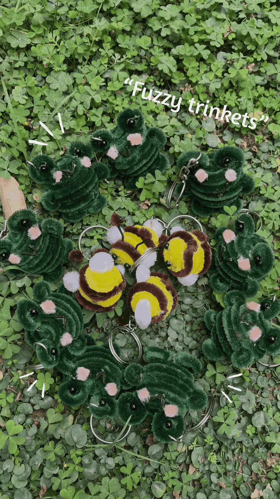 Fuzzy keychains shaped like bees and caterpillars on a green leafy background with 'Fuzzy trinkets' text.