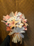 Bouquet of flowers held by a hand on a textured brown background